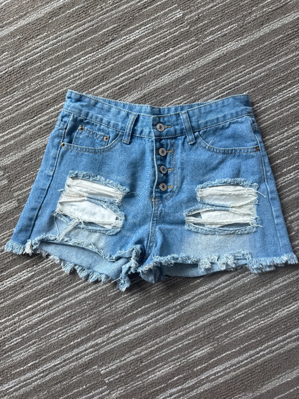 Light wash, distressed denim shorts